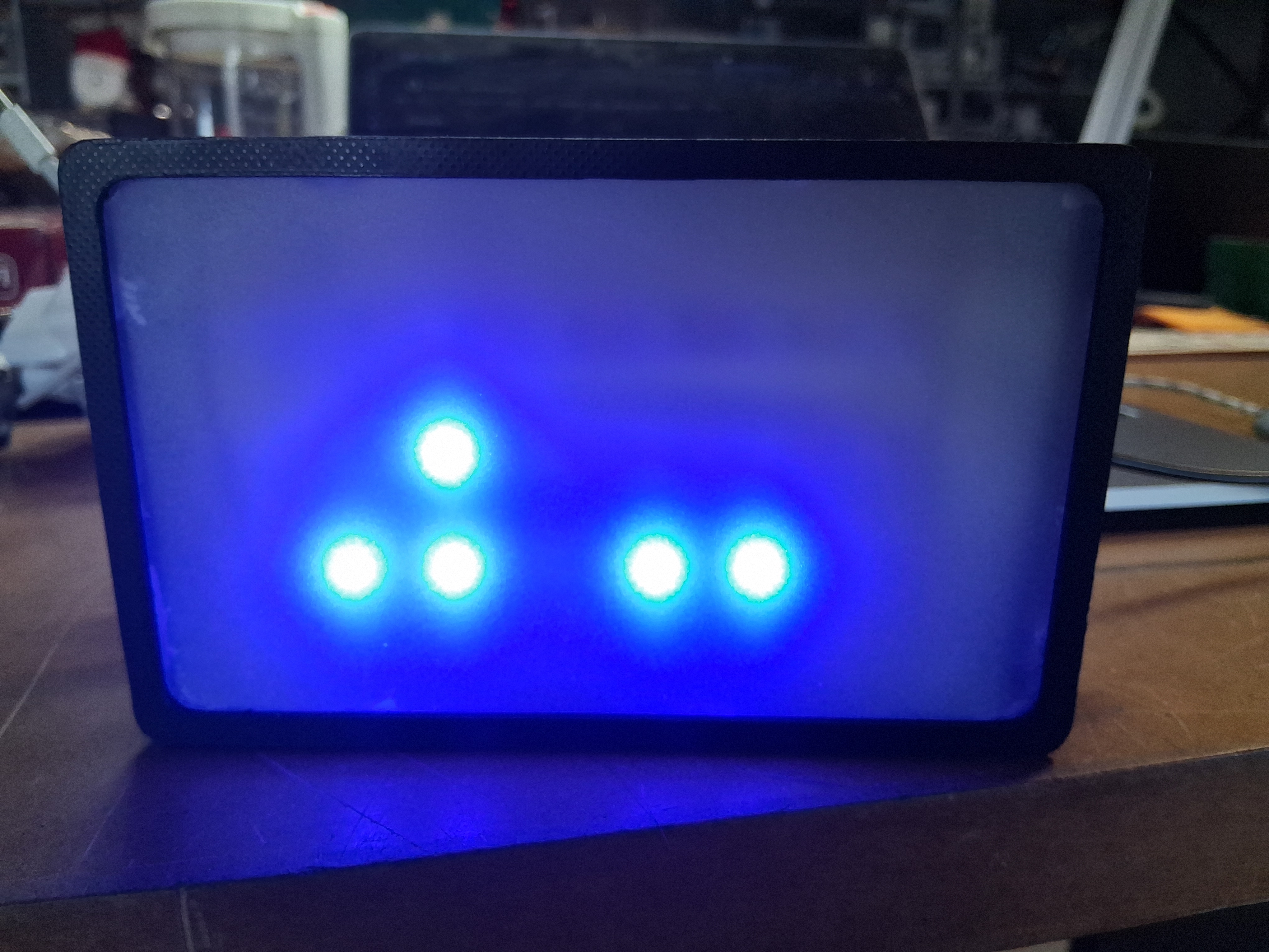 pictures of the bituhr with 4 blue blinking Neopixel